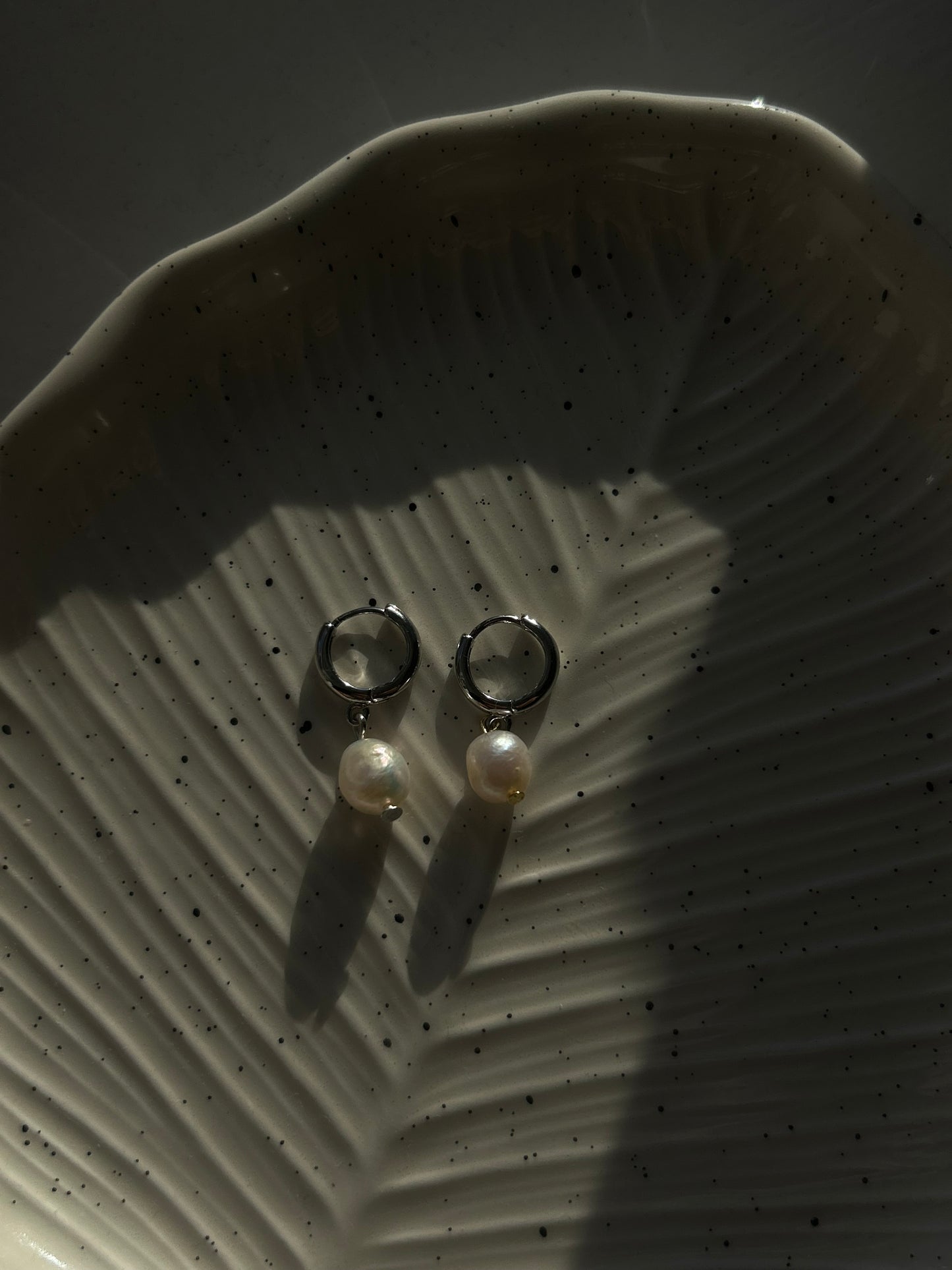 dropped pearl earrings in silver