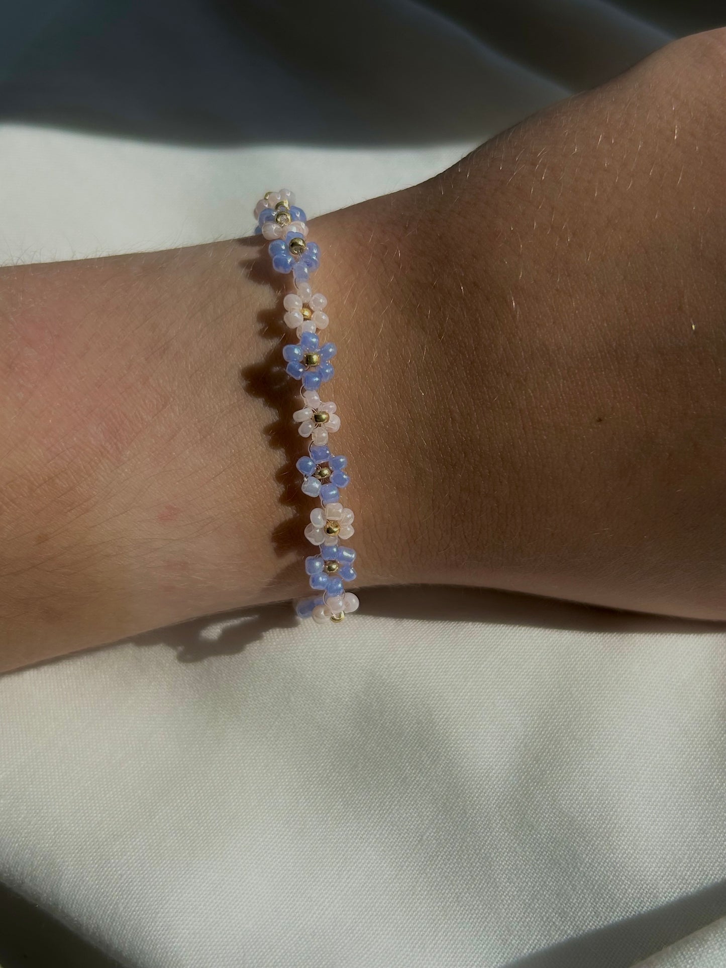 white and blue daisy chain bracelet