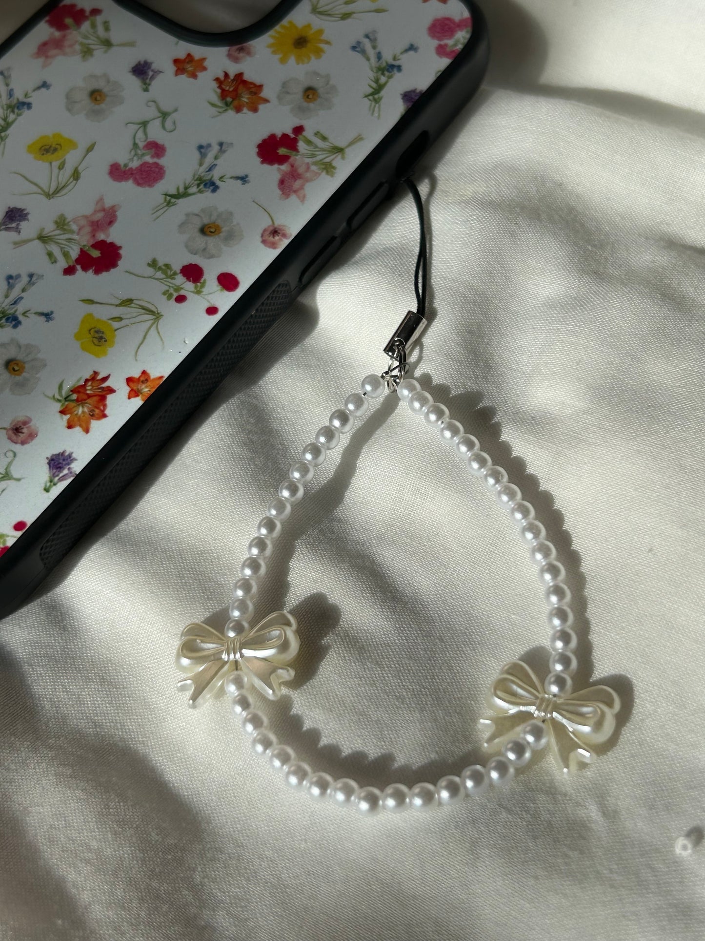 white bow phone charm