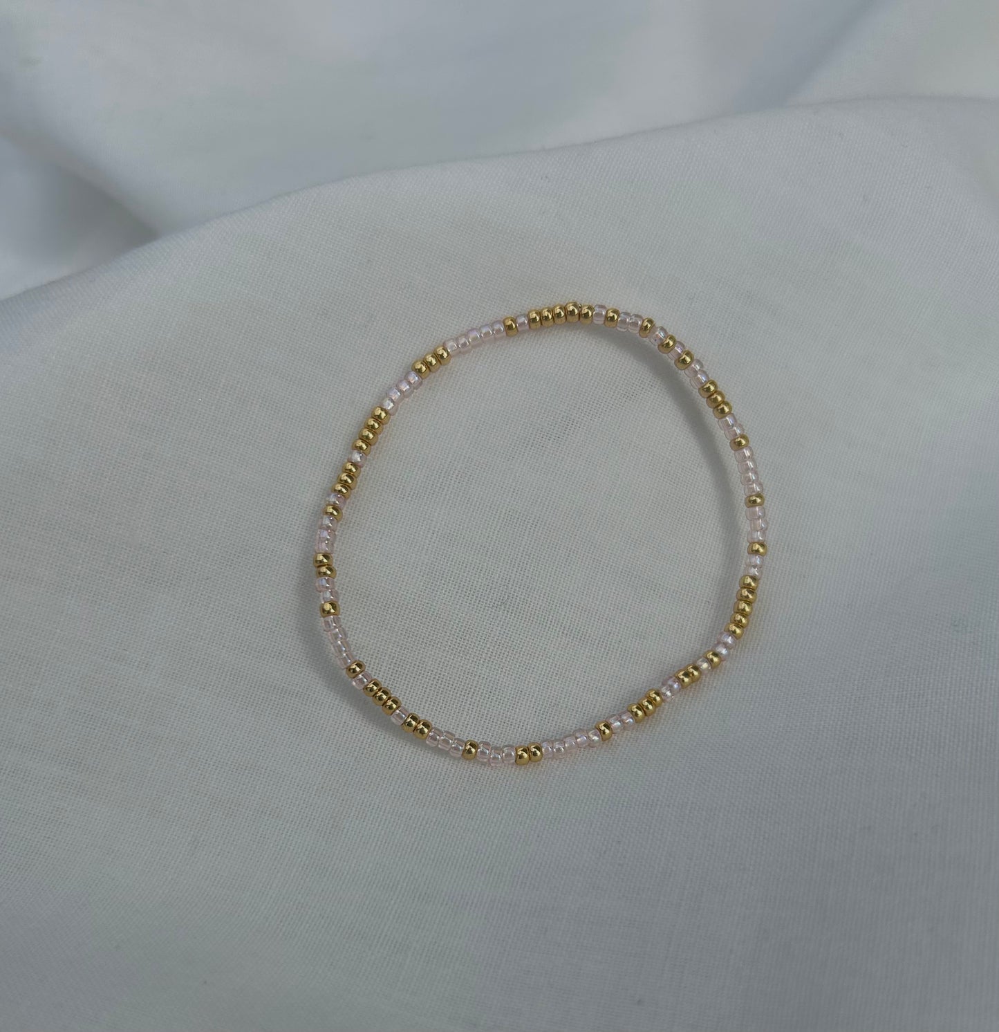 Gold and pink beaded bracelet