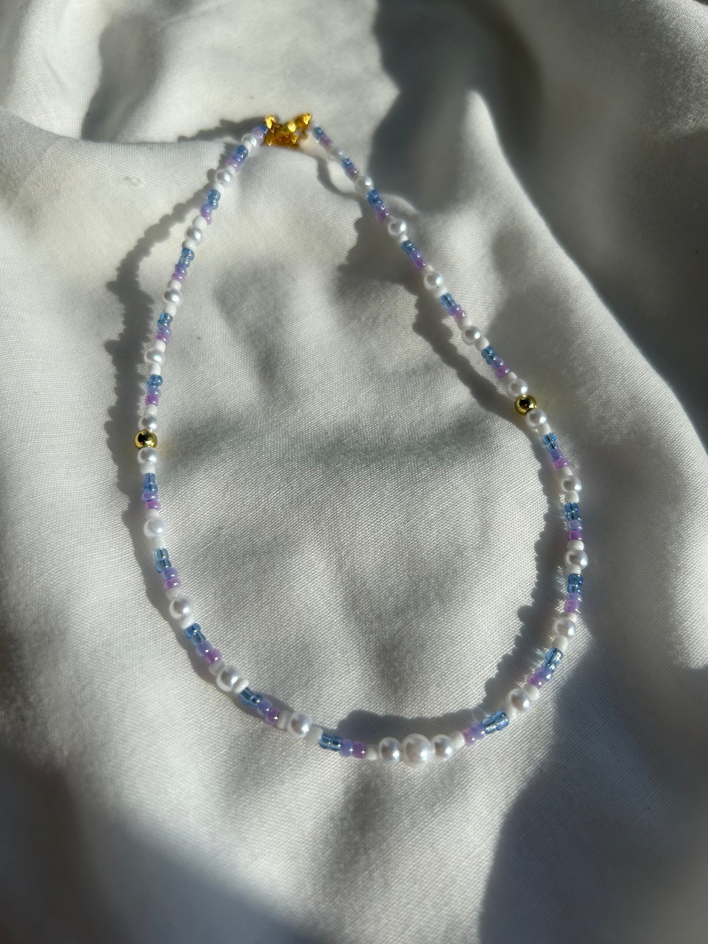 Purple and pearl necklace