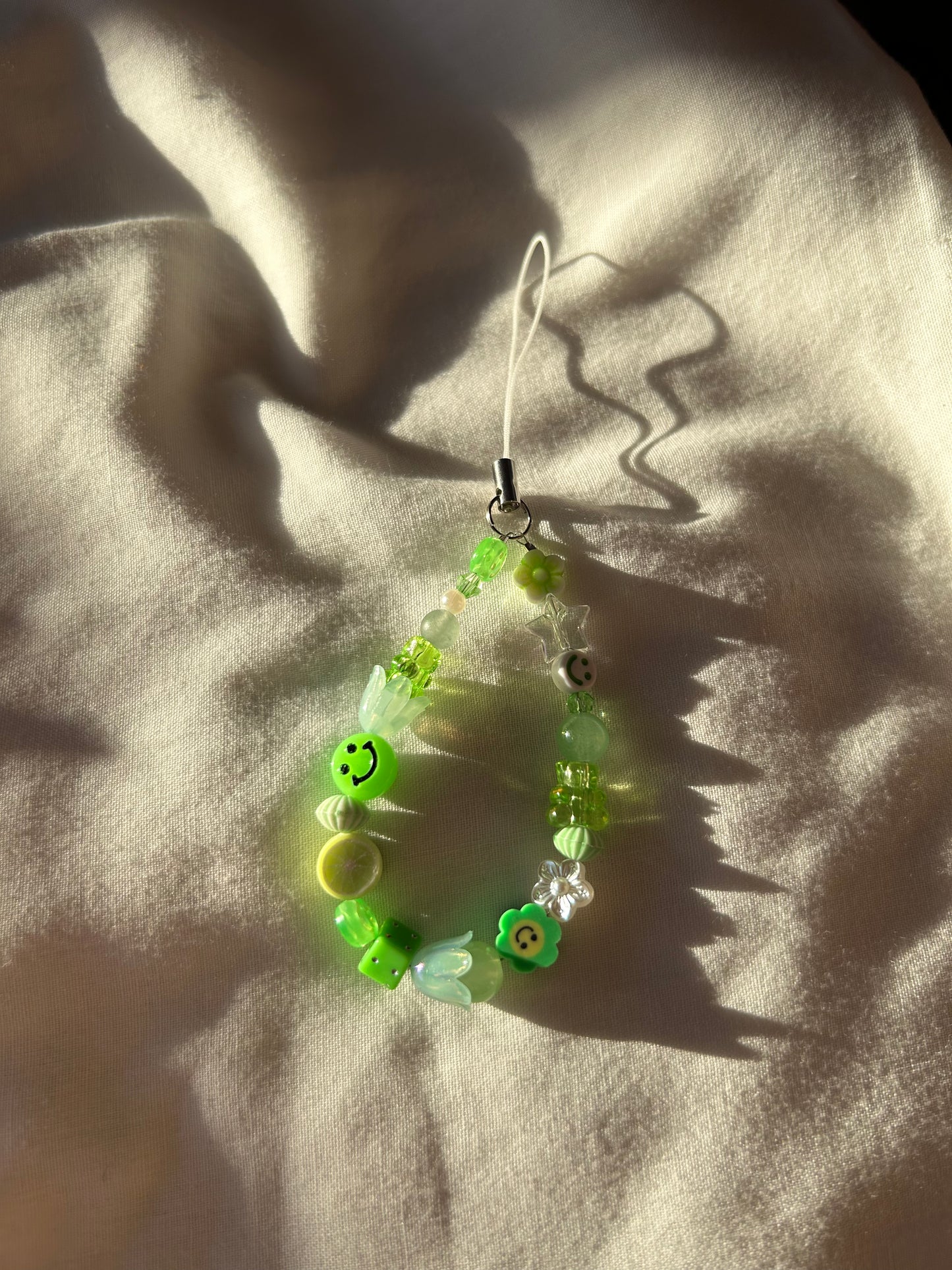 Green beaded phone charm